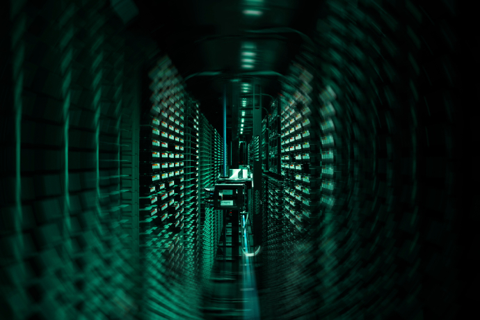 Photo of ECMWF's HPC illuminated green. The image is slightly swirled 