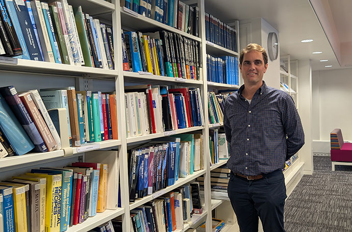 David Lavers stood by books