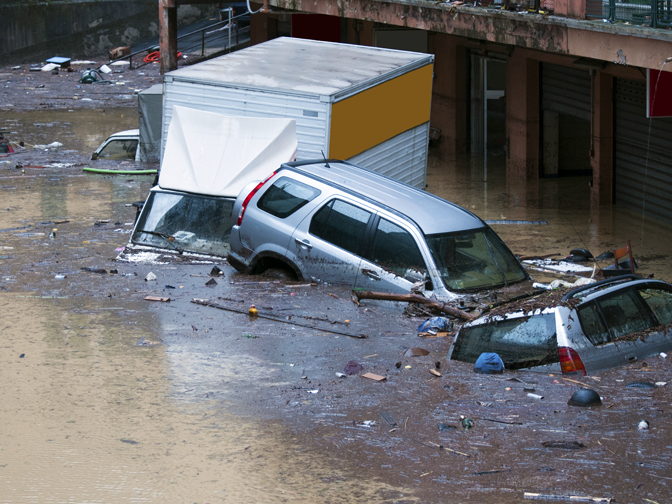 Vehicles submerged in flooded street