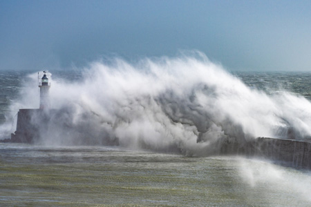 Storm waves crashing on jetty