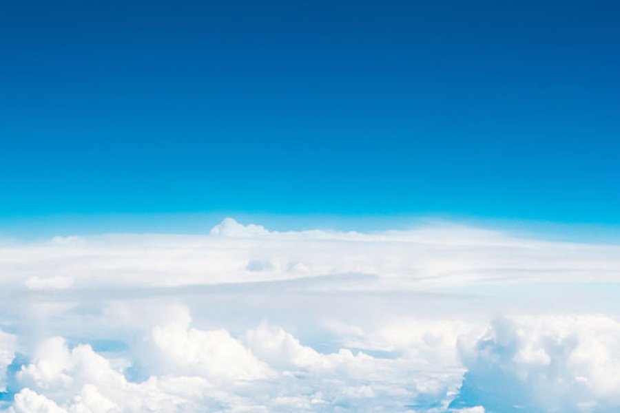 Photo of clouds with light blue leading to dark blue sky