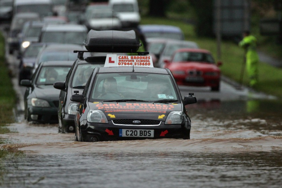 Cars driving on flooded road