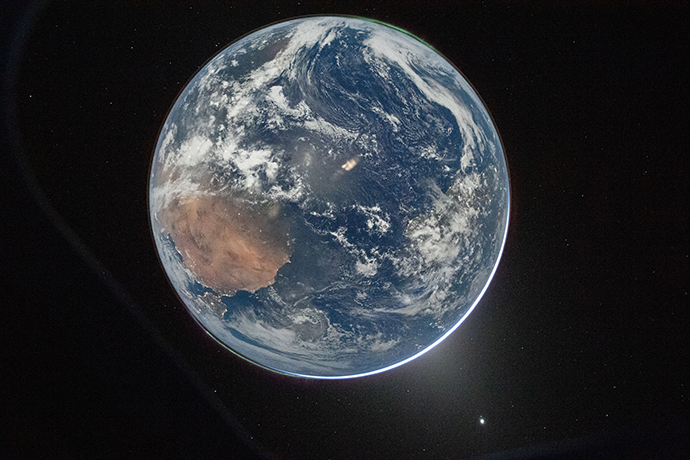 View of whole brightly lit Earth from space