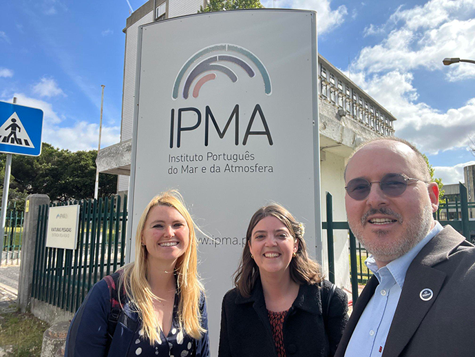 Three people taking a selfie outside of IPMA in Lisbon